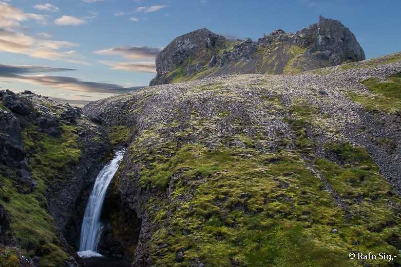 Klukkufoss. A small silk waterfall at Snæfellsnes with basalt surroundings.