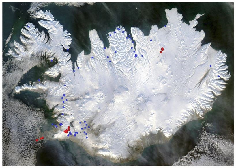 Figure 1: Satellite image of Iceland in winter time illustrating geothermal production wells in operation in year 2014 for geothermal power plants (red) and wells operated by heat utilities for distribution of heat. Over 100 production wells operated by small auto-producers are excluded.